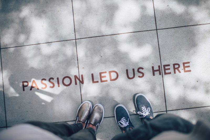 Decorative photo that has the words "Passion led us here", as it follows ASI's core values, our mission, and our journey throughout the history of this company.